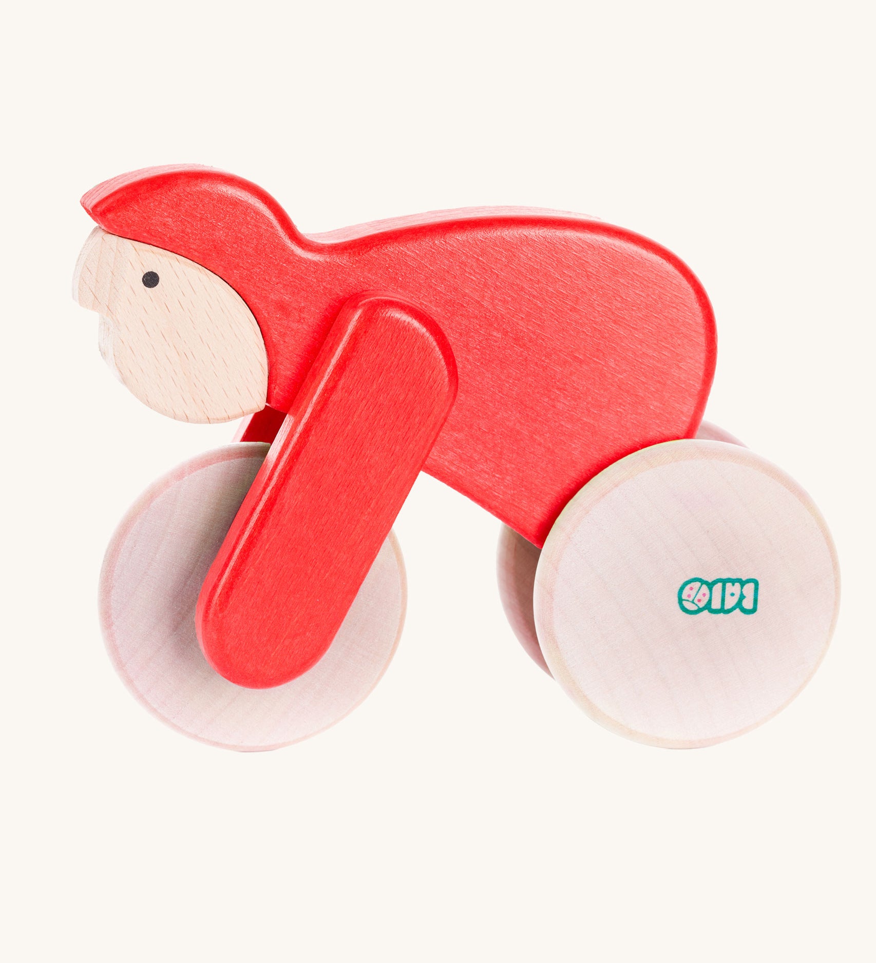A red Bajo Velo cyclist wooden toy. This wooden toy is part of a wide range of push along toys available at Babipur.