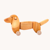 Bajo Dachshund Pull along Toy in a Natural uncoloured wood. These heirloom quality toys by Bajo are part of a wide range of wooden toys available here at Babipur. 