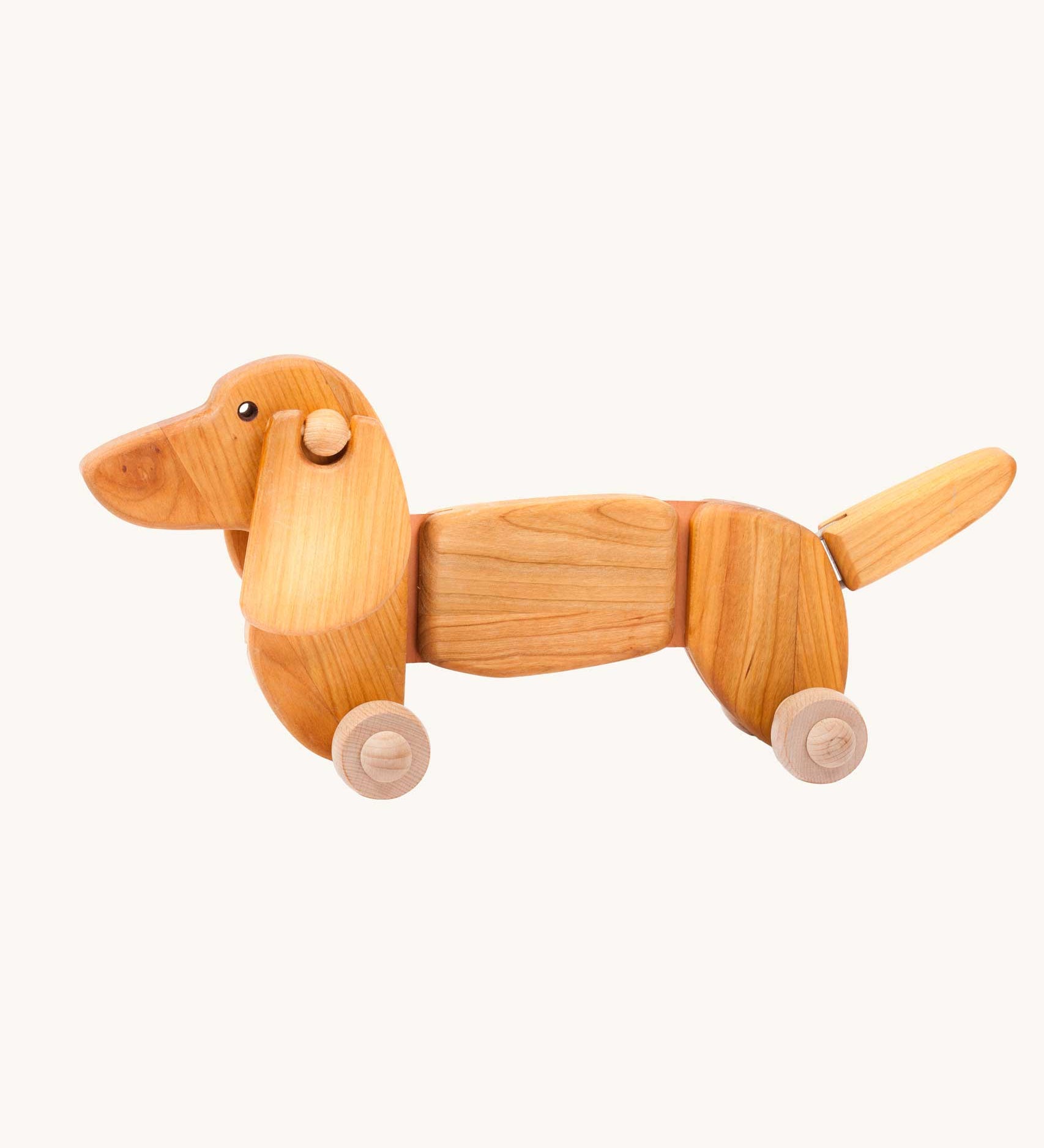 Bajo Dachshund Pull along Toy in a Natural uncoloured wood. These heirloom quality toys by Bajo are part of a wide range of wooden toys available here at Babipur. 