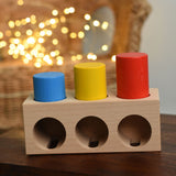 The Bajo Deep And Shallow Sorter wooden toy placed on a small wooden table. These heirloom quality toys by Bajo are part of a wide range of wooden toys available here at Babipur. 