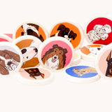 A close up of some of the wooden disc pieces included in the Bajo Dogs Memory Game. A set of 32 wooden discs featuring 16 different dog breeds printed on one side. These heirloom quality toys by Bajo are part of a wide range of wooden toys available here at Babipur.