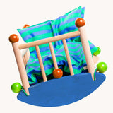 An image of the front of the Bajo wooden cot showing that the half circular base can rock from side to side. Bajo dolls wooden cot. These heirloom quality toys by Bajo are part of a wide range of wooden toys available here at Babipur.
