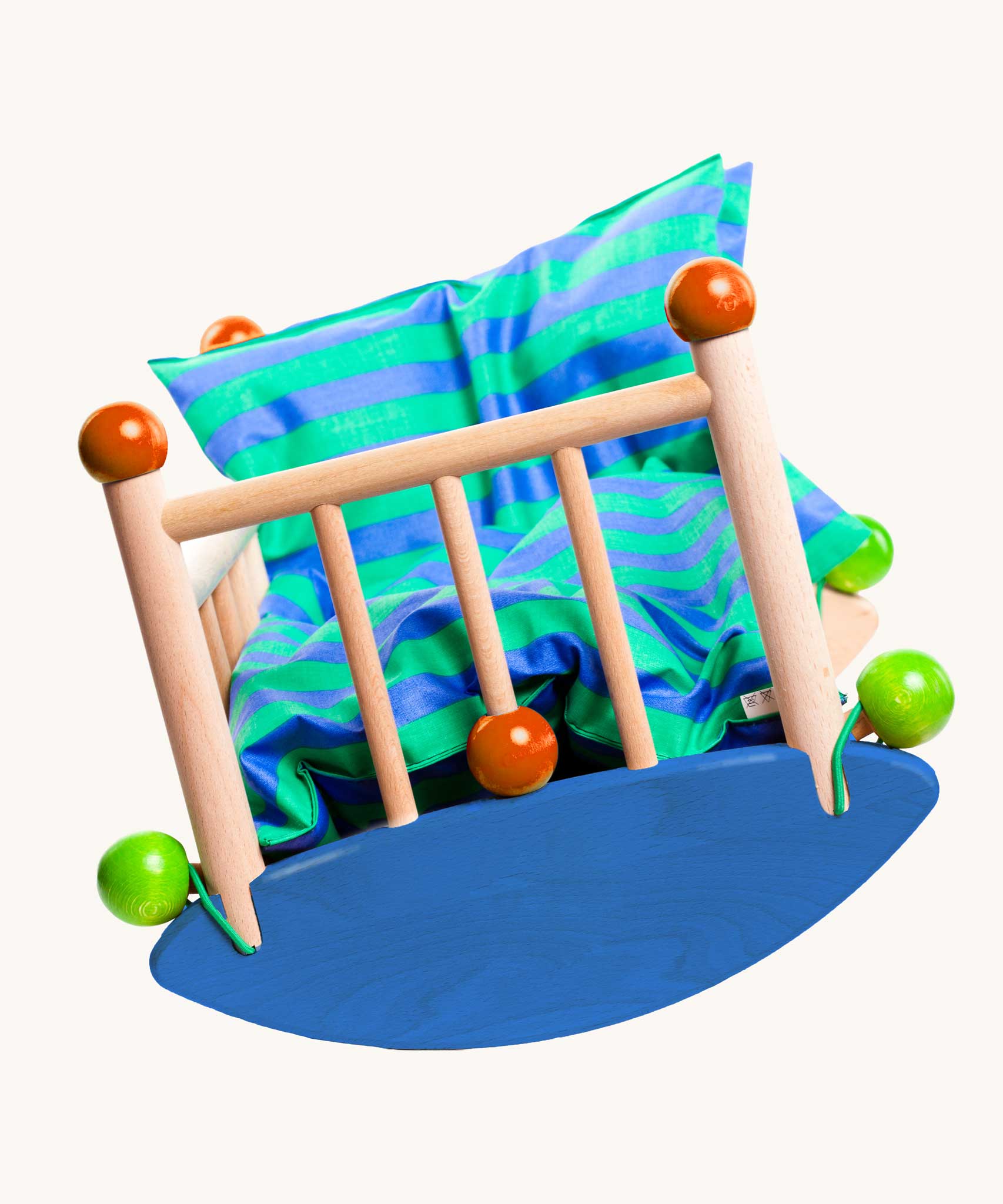 An image of the front of the Bajo wooden cot showing that the half circular base can rock from side to side. Bajo dolls wooden cot. These heirloom quality toys by Bajo are part of a wide range of wooden toys available here at Babipur.