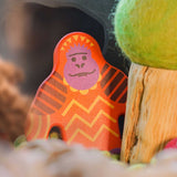 A Bajo orangutan Endangered Animals wooden toy Figure placed in a small world play scene at Babipur with an Ostheimer cave in the background and a Papoose tree besides it. 