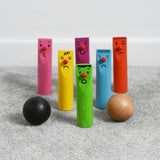 Bajo Fellow Skittles wooden toy game. Six coloured wooden skittles decorated with faces with red noses. The set comes with two wooden balls.  These heirloom quality toys by Bajo are part of a wide range of wooden toys available here at Babipur.