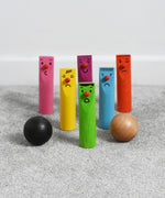 Bajo Fellow Skittles wooden toy game. Six coloured wooden skittles decorated with faces with red noses. The set comes with two wooden balls.  These heirloom quality toys by Bajo are part of a wide range of wooden toys available here at Babipur.