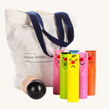 Bajo Fellow Skittles wooden toy game. Six coloured wooden skittles decorated with faces with red noses. The set comes with two wooden balls and a tote storage bag.  These heirloom quality toys by Bajo are part of a wide range of wooden toys available here at Babipur.