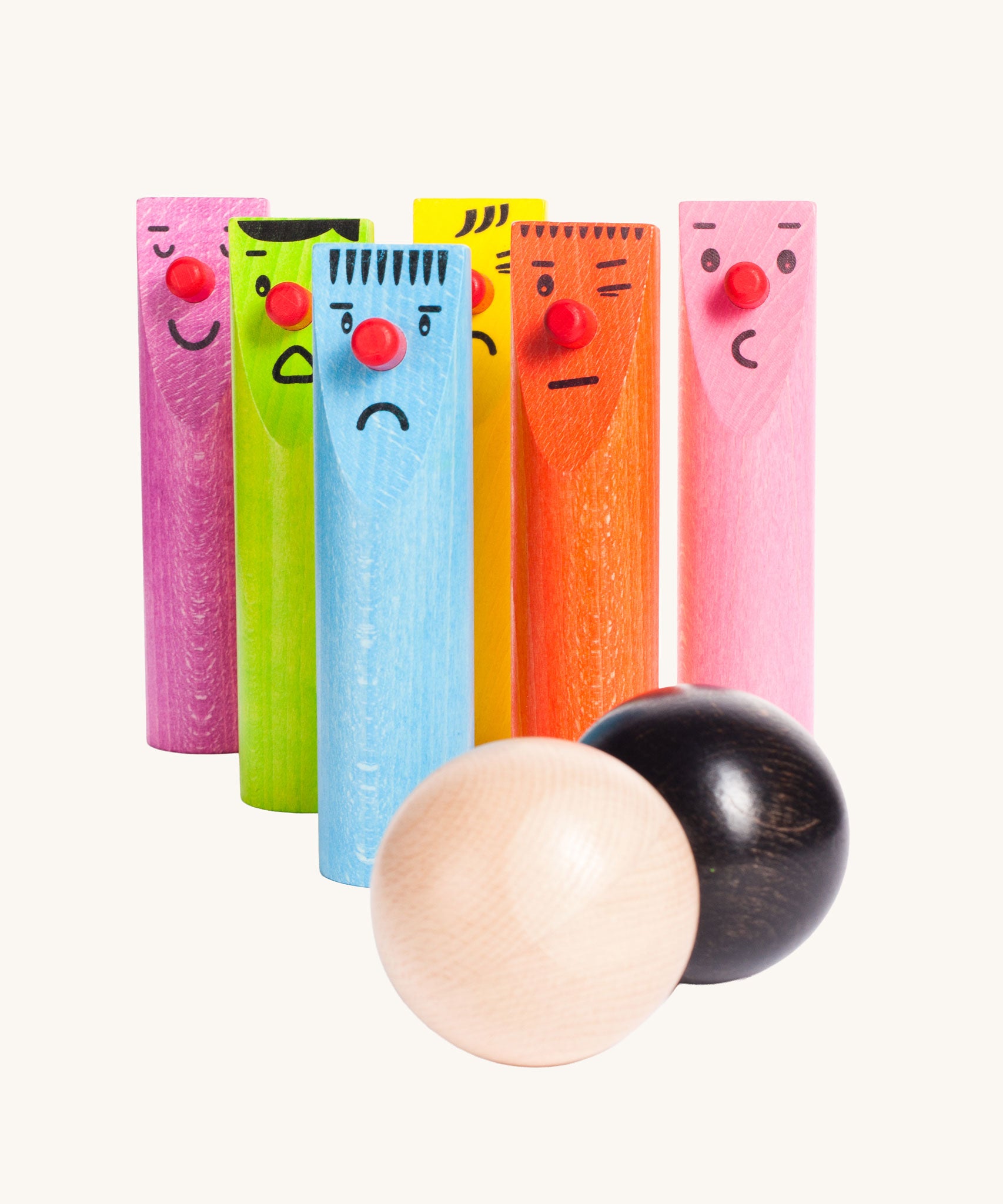 Bajo Fellow Skittles wooden toy game. Six coloured wooden skittles decorated with faces with red noses. The set comes with two wooden balls.  These heirloom quality toys by Bajo are part of a wide range of wooden toys available here at Babipur.