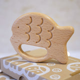 Bajo Fish Teether wooden fish shaped teetehr toy. These heirloom quality toys by Bajo are part of a wide range of wooden toys available here at Babipur. 