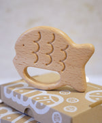 Bajo Fish Teether wooden fish shaped teetehr toy. These heirloom quality toys by Bajo are part of a wide range of wooden toys available here at Babipur. 