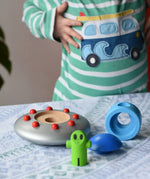 Bajo Alien Flying Saucer placed on a table with all the pieces separated. 