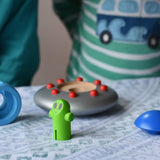 The pieces from the Bajo Alien Flying Saucer set separated and placed on a table.