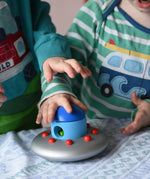 Children playing with the Bajo Alien Flying Saucer.