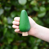 Large green conical tree from the Bajo green forest tree set in a child's hand.