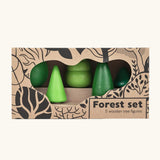 Bajo forest wooden toy tree figure set. Five green trees in different heights and shapes shown in their cardboard packaging box.