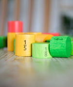 Bajo Fractions Set. A set of coloured wooden blocks marked with fractions on each block. These heirloom quality toys by Bajo are part of a wide range of wooden toys available here at Babipur.