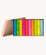 Bajo wooden fractions set early maths learning. Colourful wooden cylinders split into fractions from 1 whole to 1/10 shown in a cardboard packaging box.