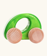 Bajo handmade wooden ellipse car in green with a oval cut out in the center for grip and unpainted wheels