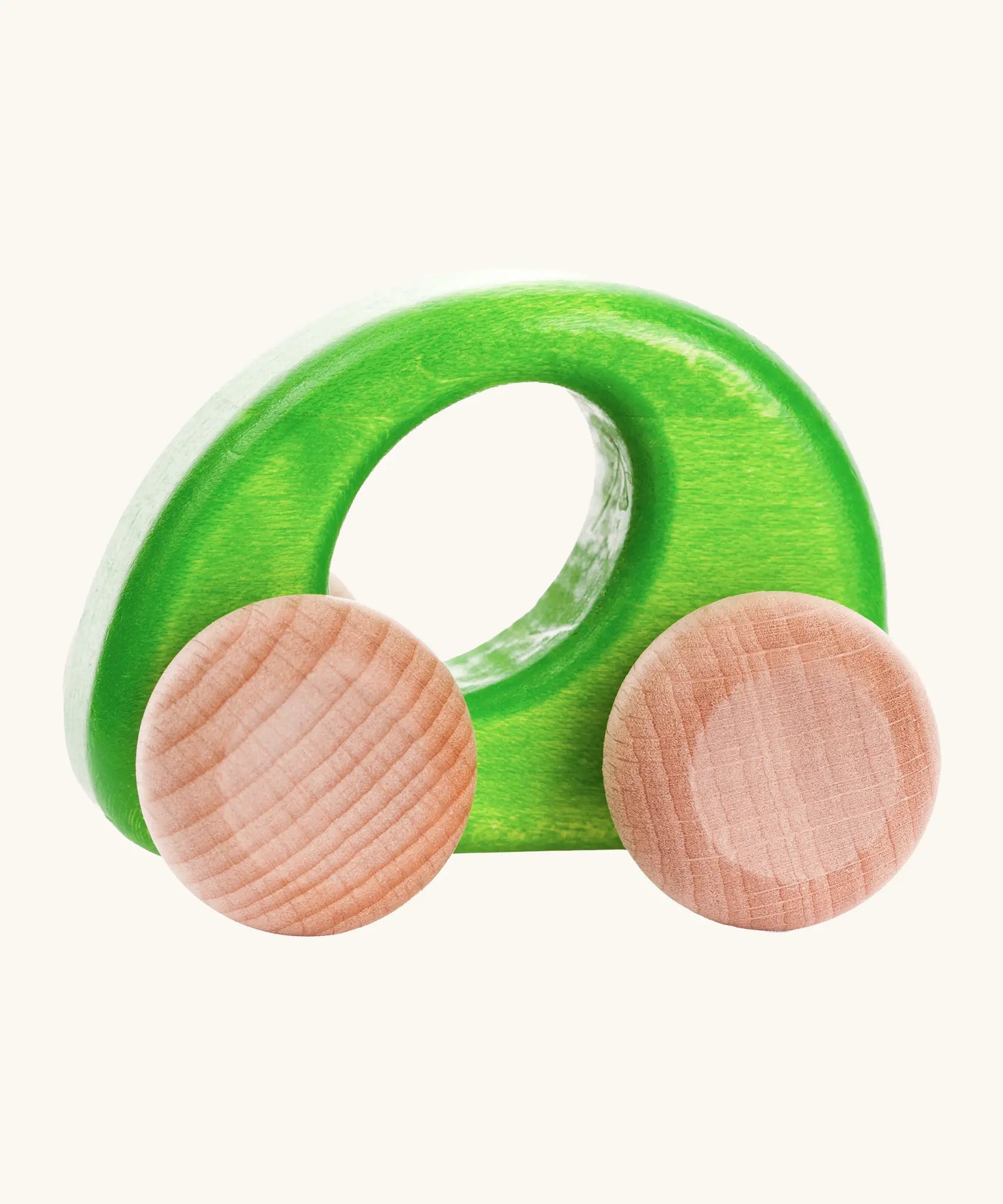 Bajo handmade wooden ellipse car in green with a oval cut out in the center for grip and unpainted wheels