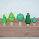 Bajo forest wooden toy tree figure set. Five green trees in different heights and shapes.