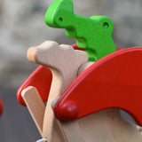 A close up of the head of the dragon's face of the Bajo green pull along dragon wooden toy. These heirloom quality toys by Bajo are part of a wide range of wooden toys available here at Babipur.