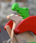 A close up of the head of the dragon's face of the Bajo green pull along dragon wooden toy. These heirloom quality toys by Bajo are part of a wide range of wooden toys available here at Babipur.