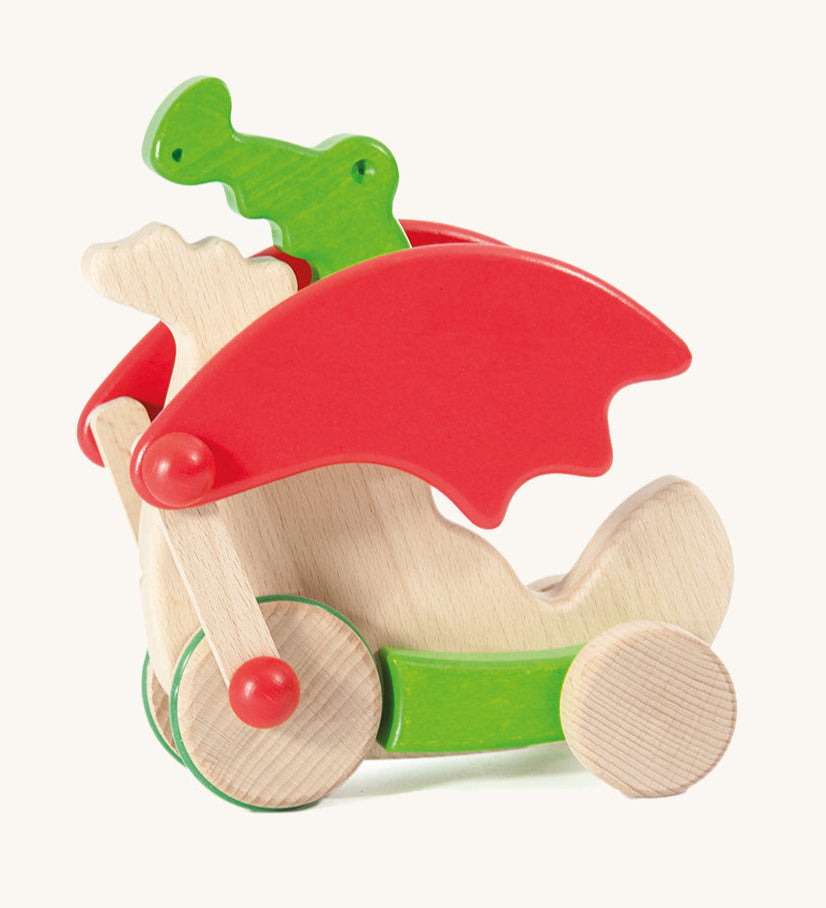 Bajo green pull along dragon wooden toy available at Babipur. Features two wheels at the front and back and red wing that move along with the front wheels