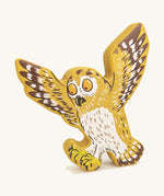 Bajo plastic-free wooden Gruffalo owl figure on a cream background