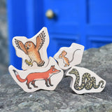 Bajo Gruffalo Character Puzzle pieces placed on a stone wall outdoors. 