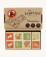 Bajo Wooden Gruffalo Domino Game with the domino's at in the box, and the lid above, on a cream background