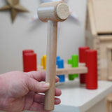 A close up of the hammper with felt pads on the end from the Bajo Hammering Board wooden toy. These heirloom quality toys by Bajo are part of a wide range of wooden toys available here at Babipur.