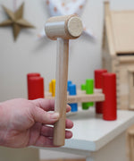 A close up of the hammper with felt pads on the end from the Bajo Hammering Board wooden toy. These heirloom quality toys by Bajo are part of a wide range of wooden toys available here at Babipur.