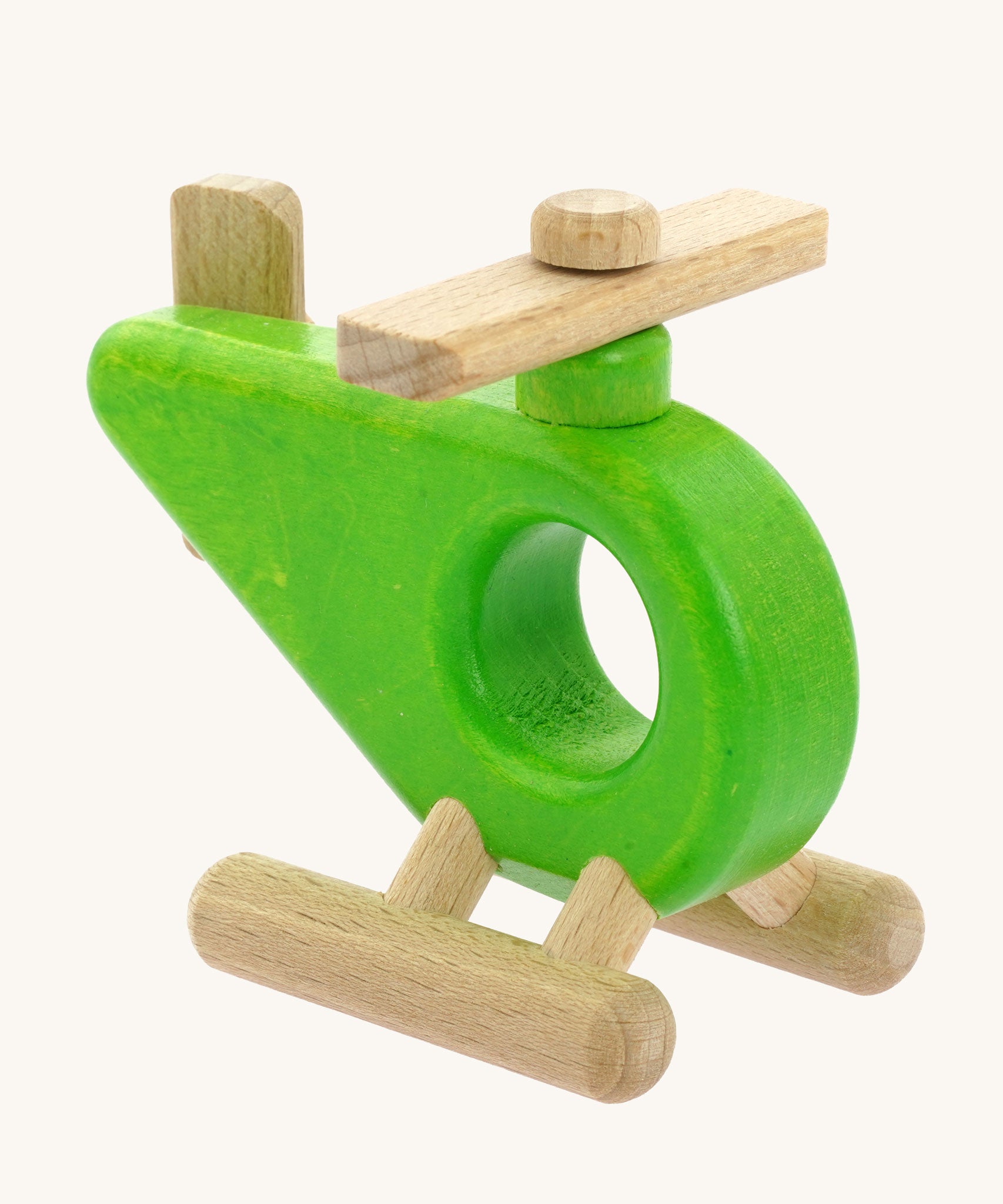 A green Bajo Helicopter wooden toy. This helicopter is part of a large range of wooden toys available here at Babipur. 