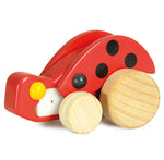 The Bajo Pull-Back Ladybird has natural wood wheels