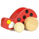 The Bajo Pull-Back Ladybird has natural wood wheels