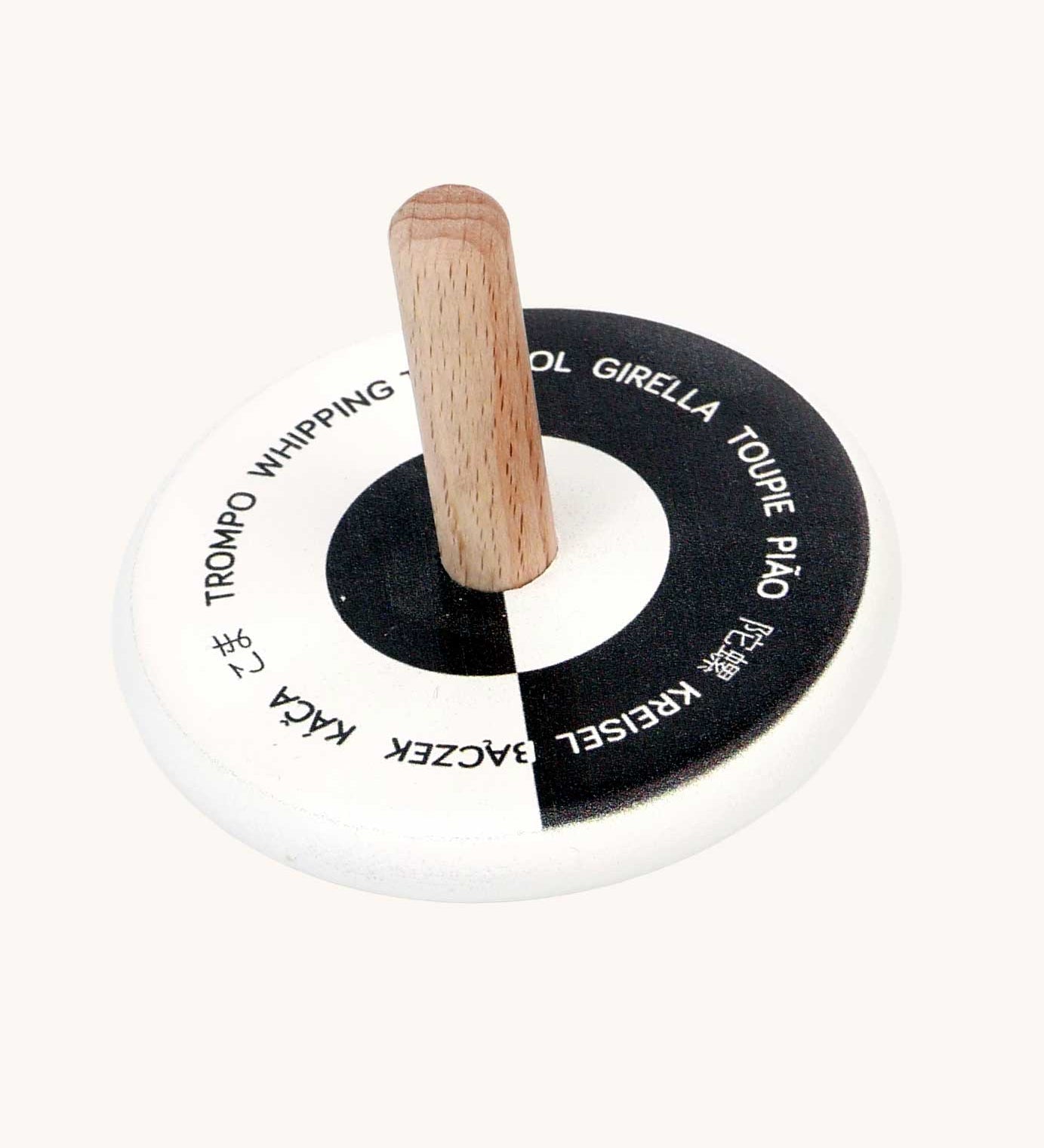 Bajo Languages Spinning Top. A black and white monochrome wooden spinning top with a natural wooden stick.