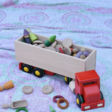 Bajo large truck and trailer wooden toy with trailer filled with Grapat number coins and wooden peg dolls. 