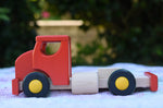 The side of the Bajo large truck and trailer wooden toy shown without the trailer. 