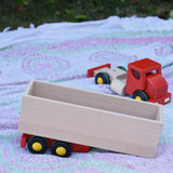 Bajo large truck and trailer wooden toy shown with the trailer separated from the red cab. 