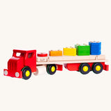 Bajo Large Red Cargo Truck. A truck an trailer with stacking shapes on the back of the trailer. 