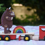 Gruffalo and mini Grimm's rainbow placed on the back of the Bajo large truck and trailer wooden toy with the trailer box removed.