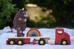 Gruffalo and mini Grimm's rainbow placed on the back of the Bajo large truck and trailer wooden toy with the trailer box removed.
