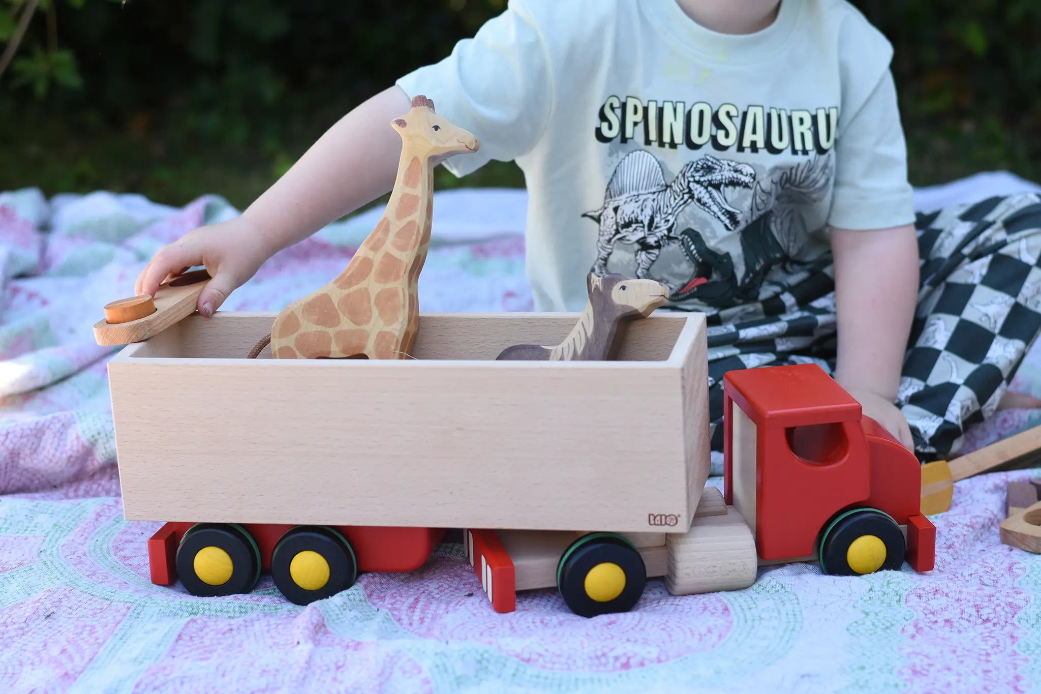 Bajo large truck and trailer wooden toy with Holztiger giraffe and horse placed in the trailer. 