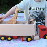 Bajo large truck and trailer wooden toy with Holztiger giraffe and horse placed in the trailer. 