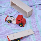 Bajo large truck and trailer wooden toy with the cab, trailer base and trailer box separated.  