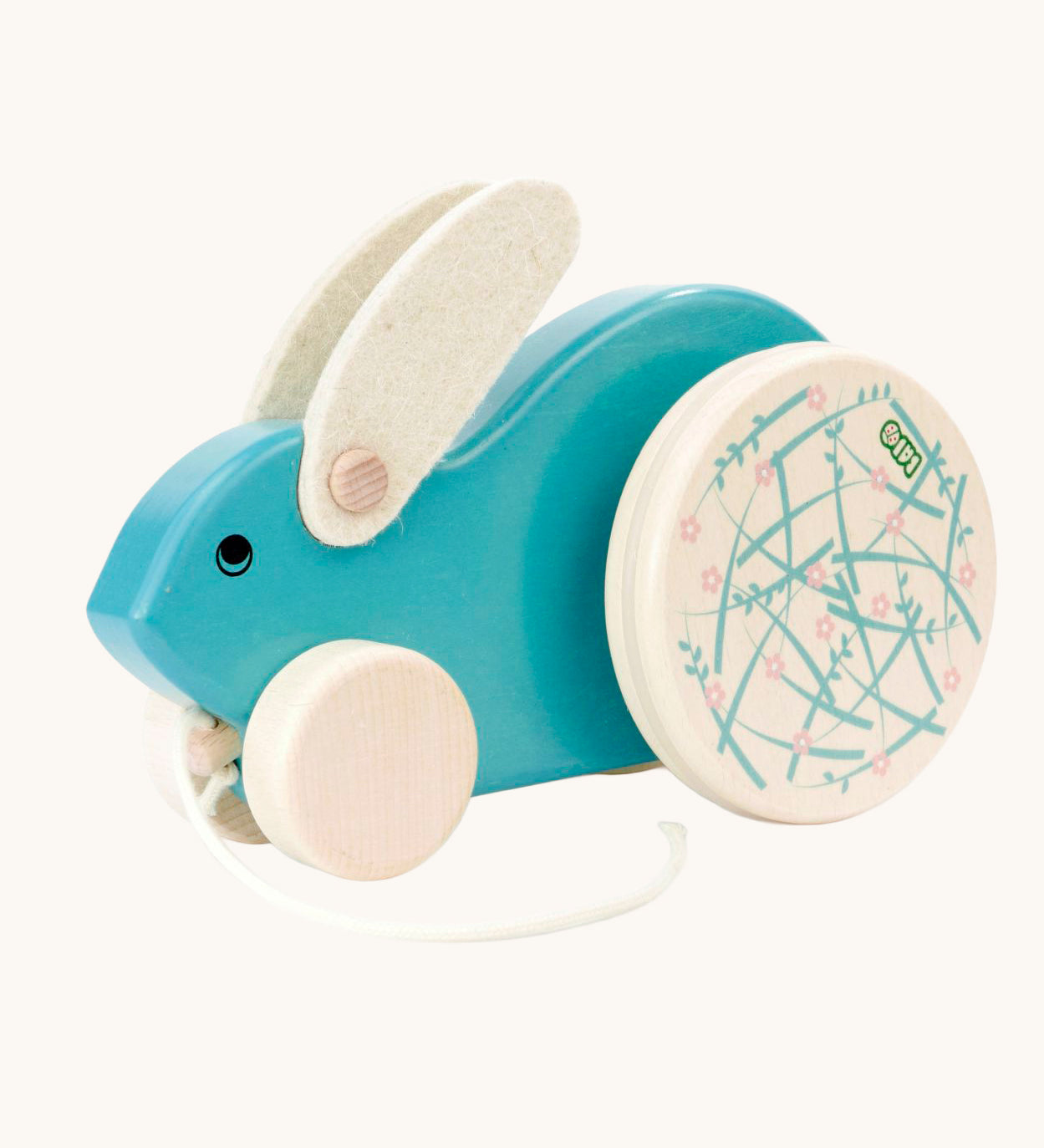 A blue Bajo Big Rabbit toy. This pull along wooden toy has small wheels at the front and large decorated wheels at the back. The rabbit makes a jumping motion as it is being pulled along. We have a wide range of Bajo wooden toys available here at Babipur. 