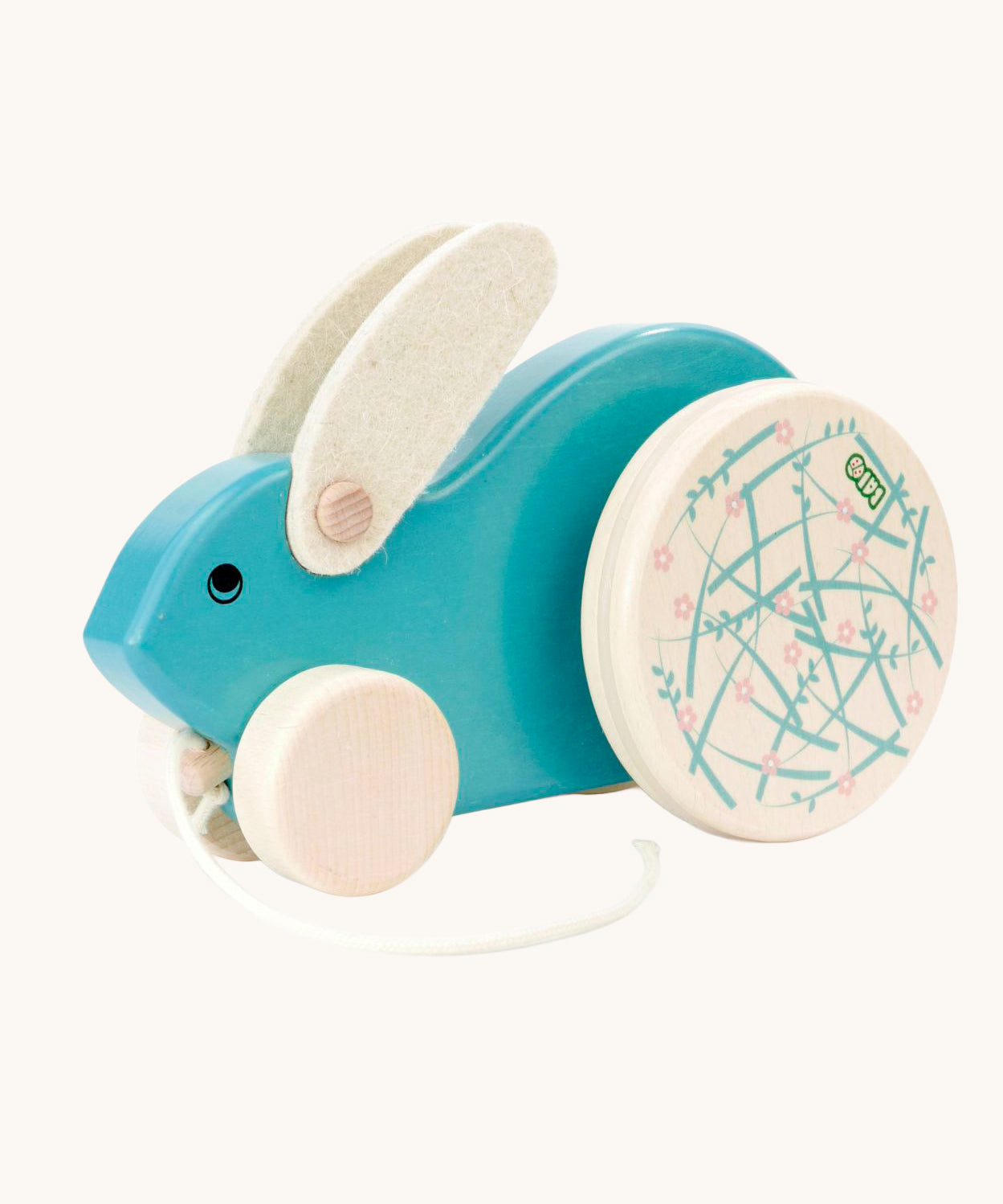A blue Bajo Big Rabbit toy. This pull along wooden toy has small wheels at the front and large decorated wheels at the back. The rabbit makes a jumping motion as it is being pulled along. We have a wide range of Bajo wooden toys available here at Babipur. 