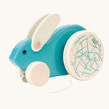 A blue Bajo Big Rabbit toy. This pull along wooden toy has small wheels at the front and large decorated wheels at the back. The rabbit makes a jumping motion as it is being pulled along. We have a wide range of Bajo wooden toys available here at Babipur. 