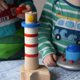 Children playing with the Bajo Lighthouse Stacker.