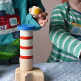 Children playing with the Bajo Lighthouse Stacker.